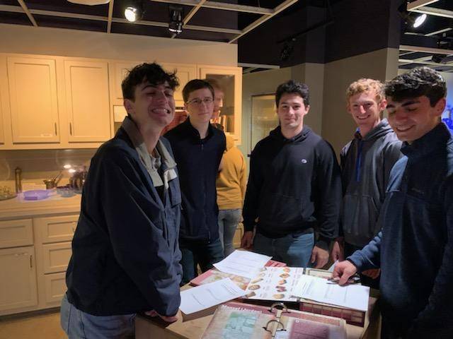 Five students standing in a kitchen museum exhibit in the Arab American Museum